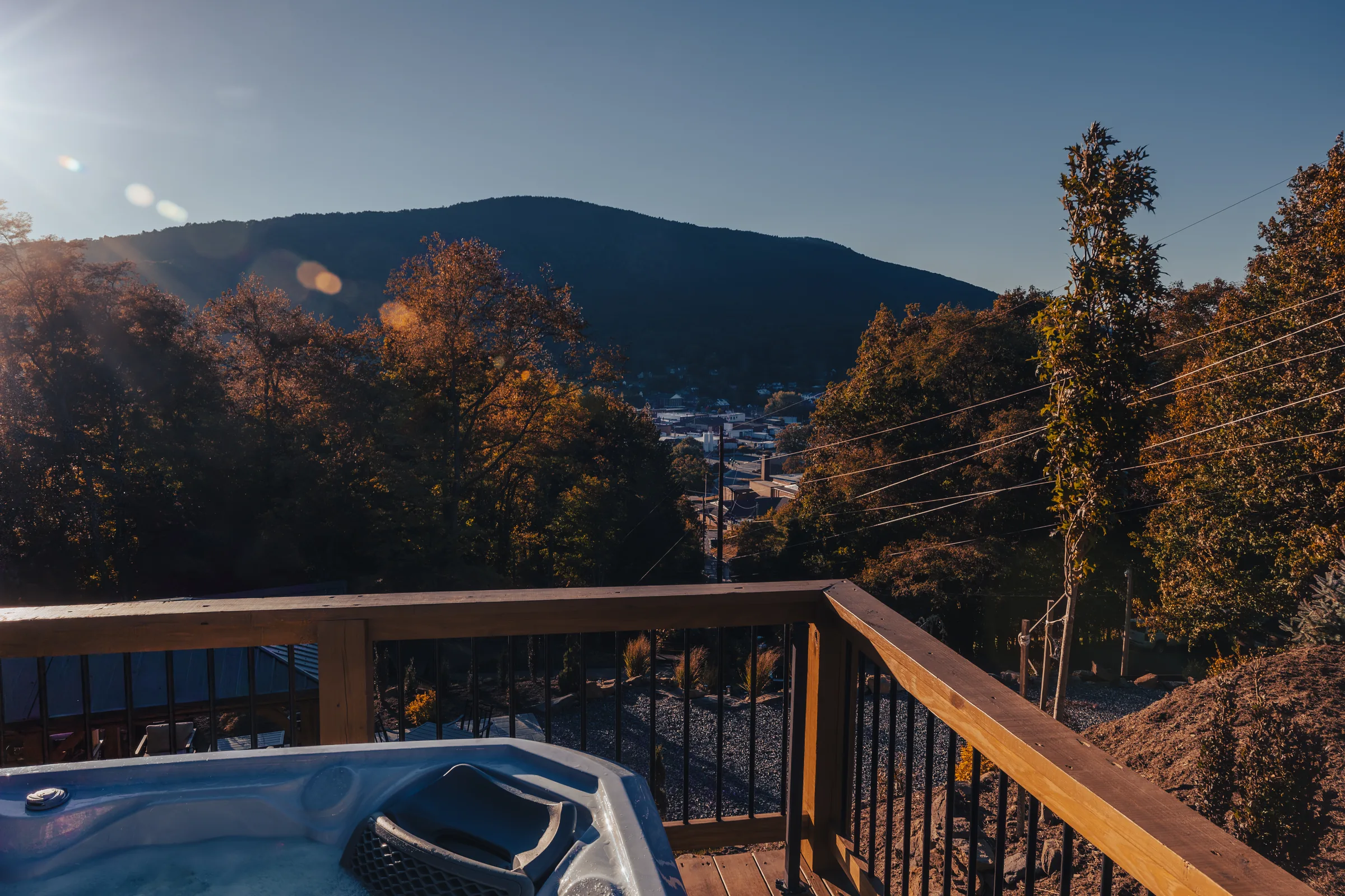 A High Peak hot tub on a deck facing an autumn mountain view in West Jefferson, NC.
