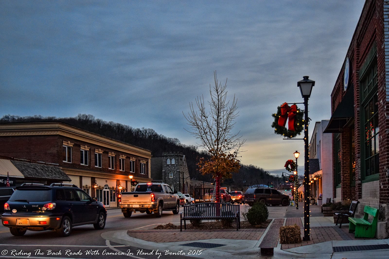 Downtown West Jefferson on a November evening, with streetlights on along the brick storefronts