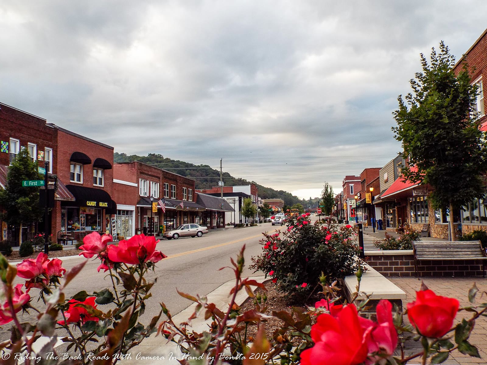 Downtown West Jefferson on a September morning, with brick buildings along the street and Mount Jefferson in the distance