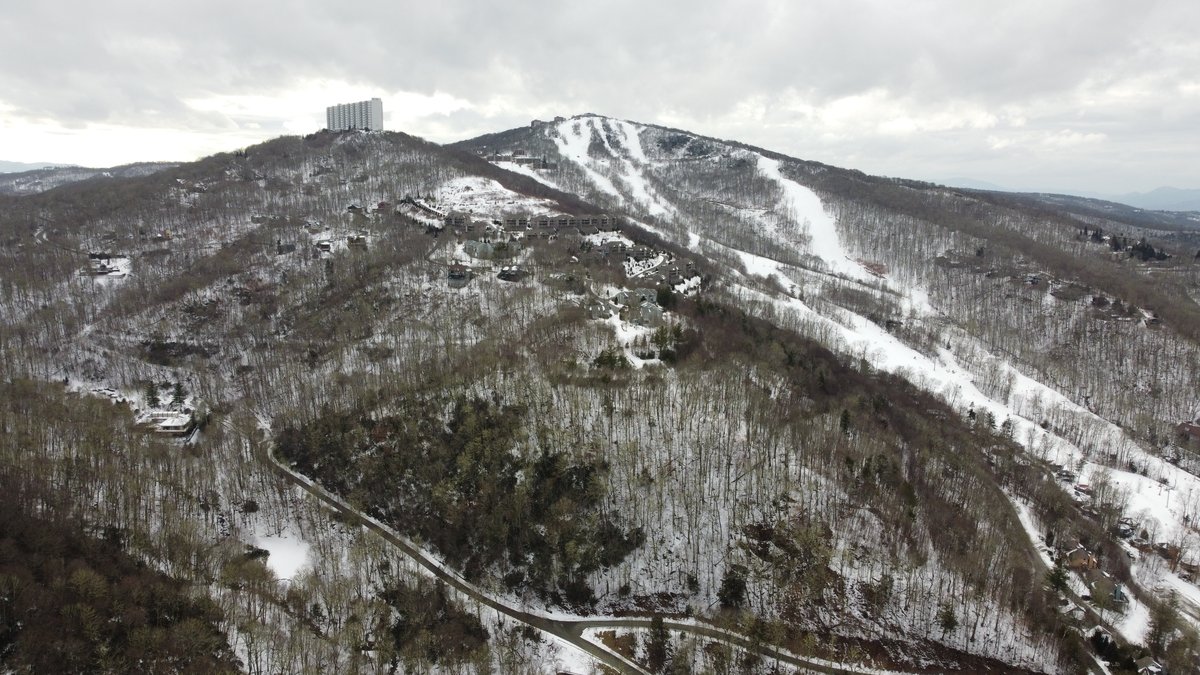 Snow-covered ski trails winding down Sugar Mountain in North Carolina's High Country.