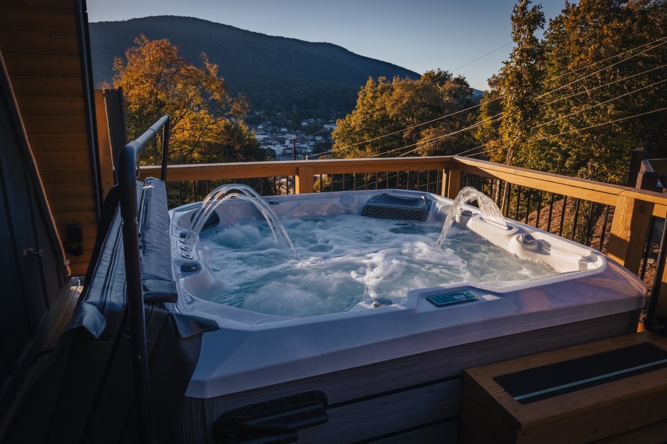 Hot tub on the deck with mountain and town views