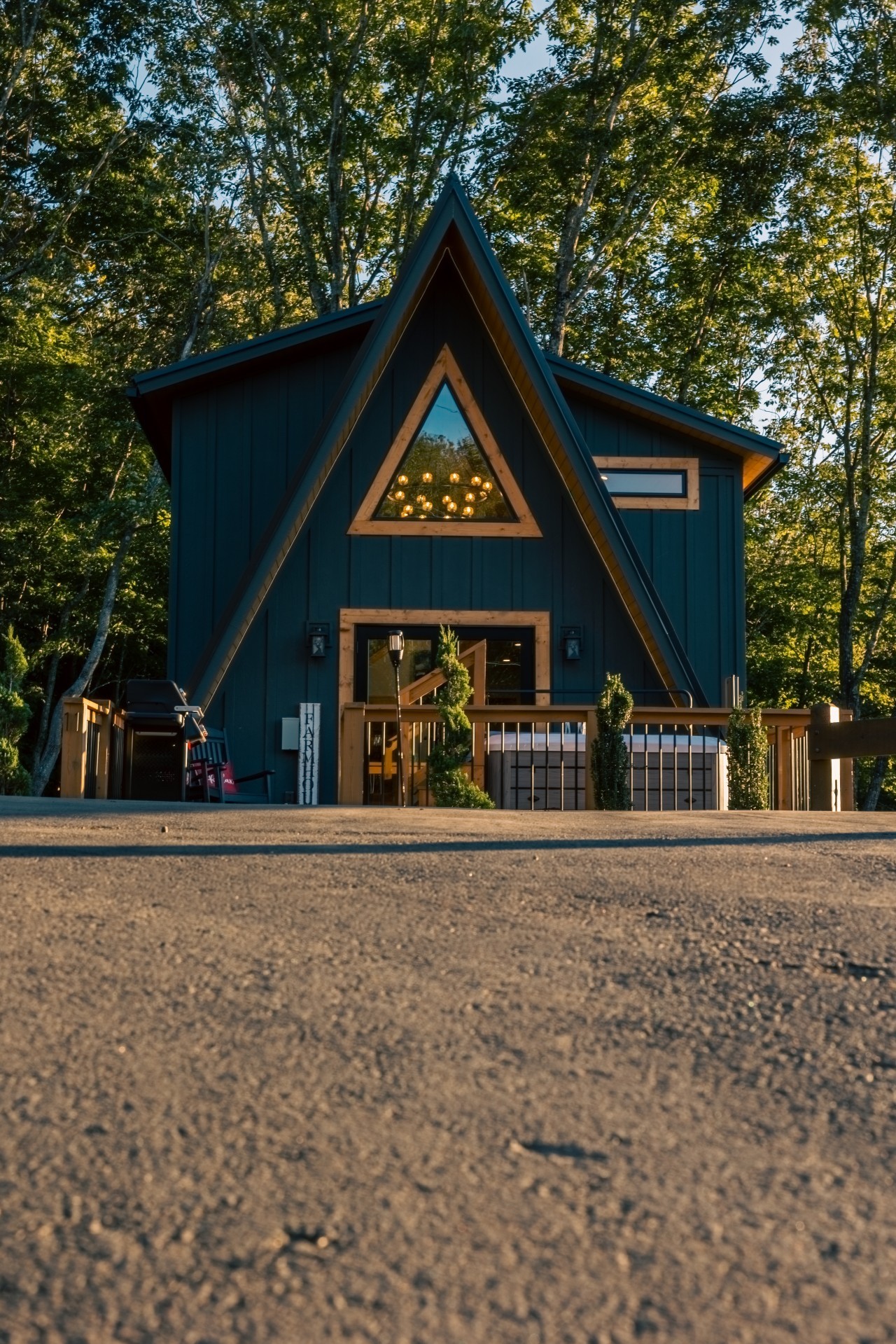 Front of the A-frame cabin from the driveway