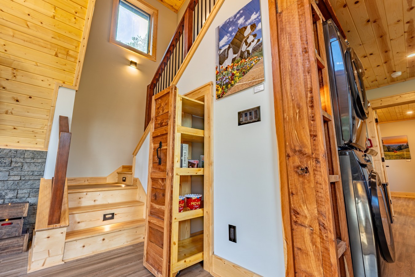 Lit staircase with built-in shelving