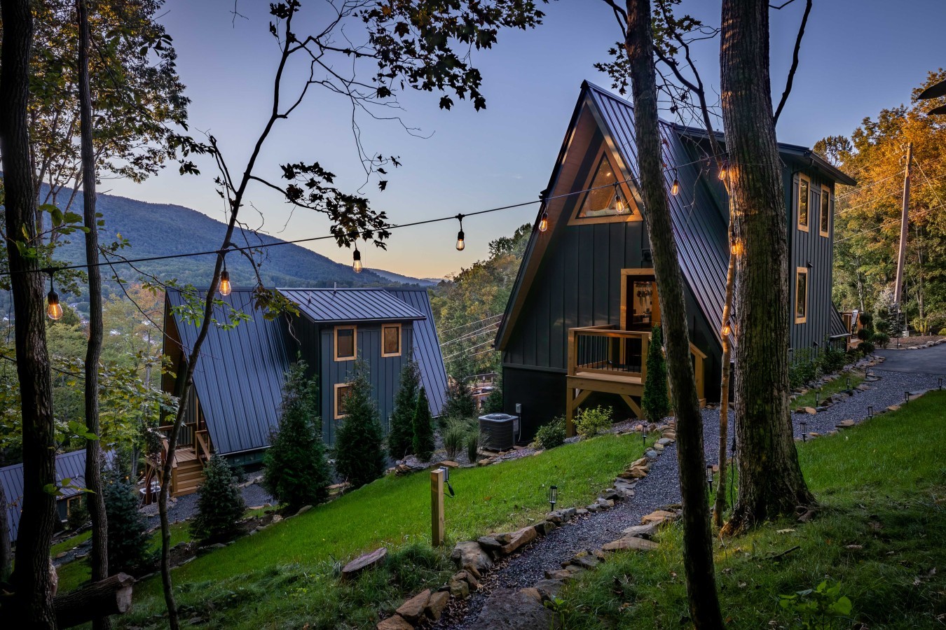 Cabins along the gravel walking path at dusk