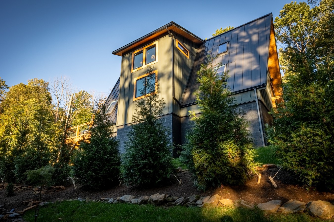 Cabin exterior with evergreen landscaping