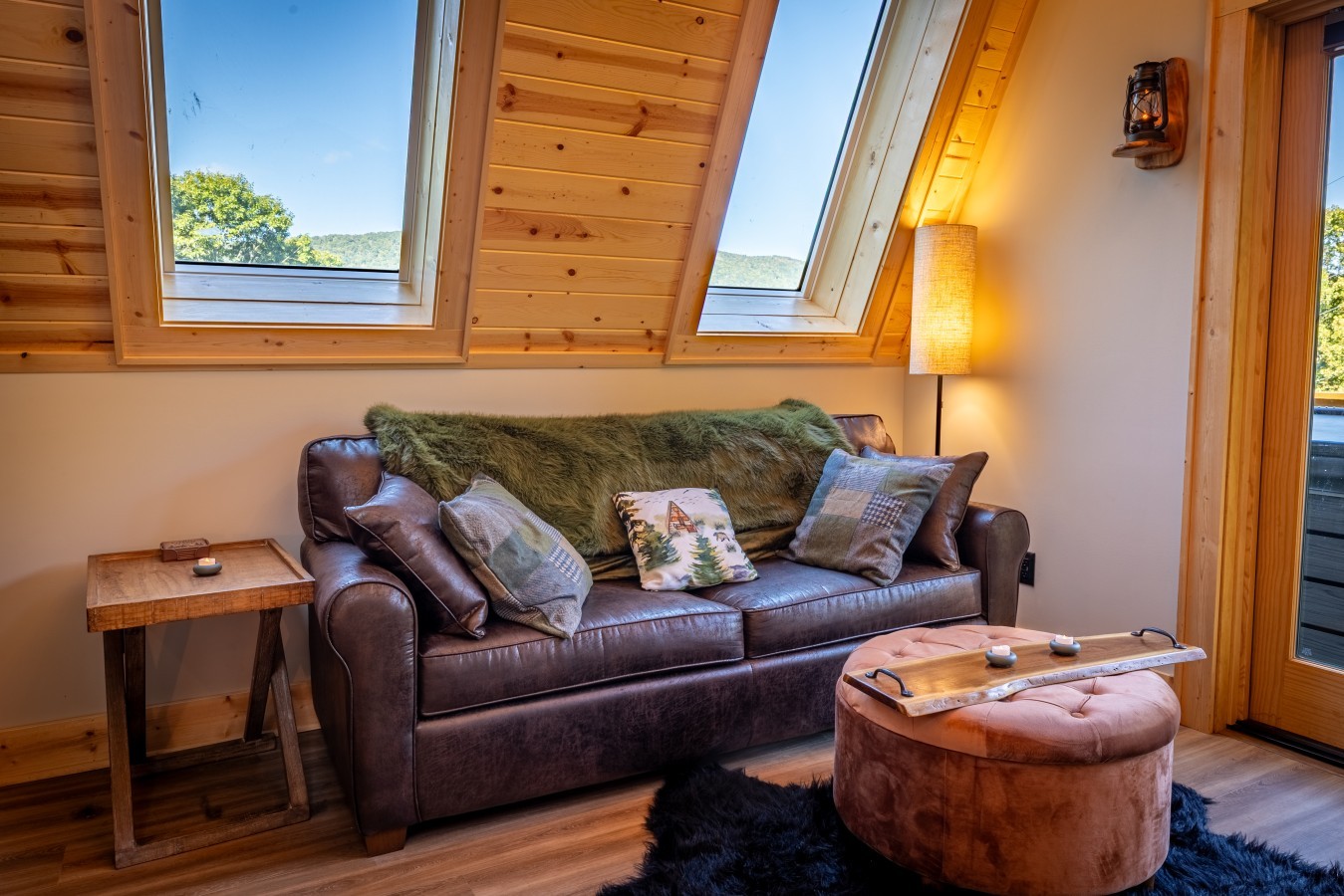 Sitting area with leather sofa under skylights