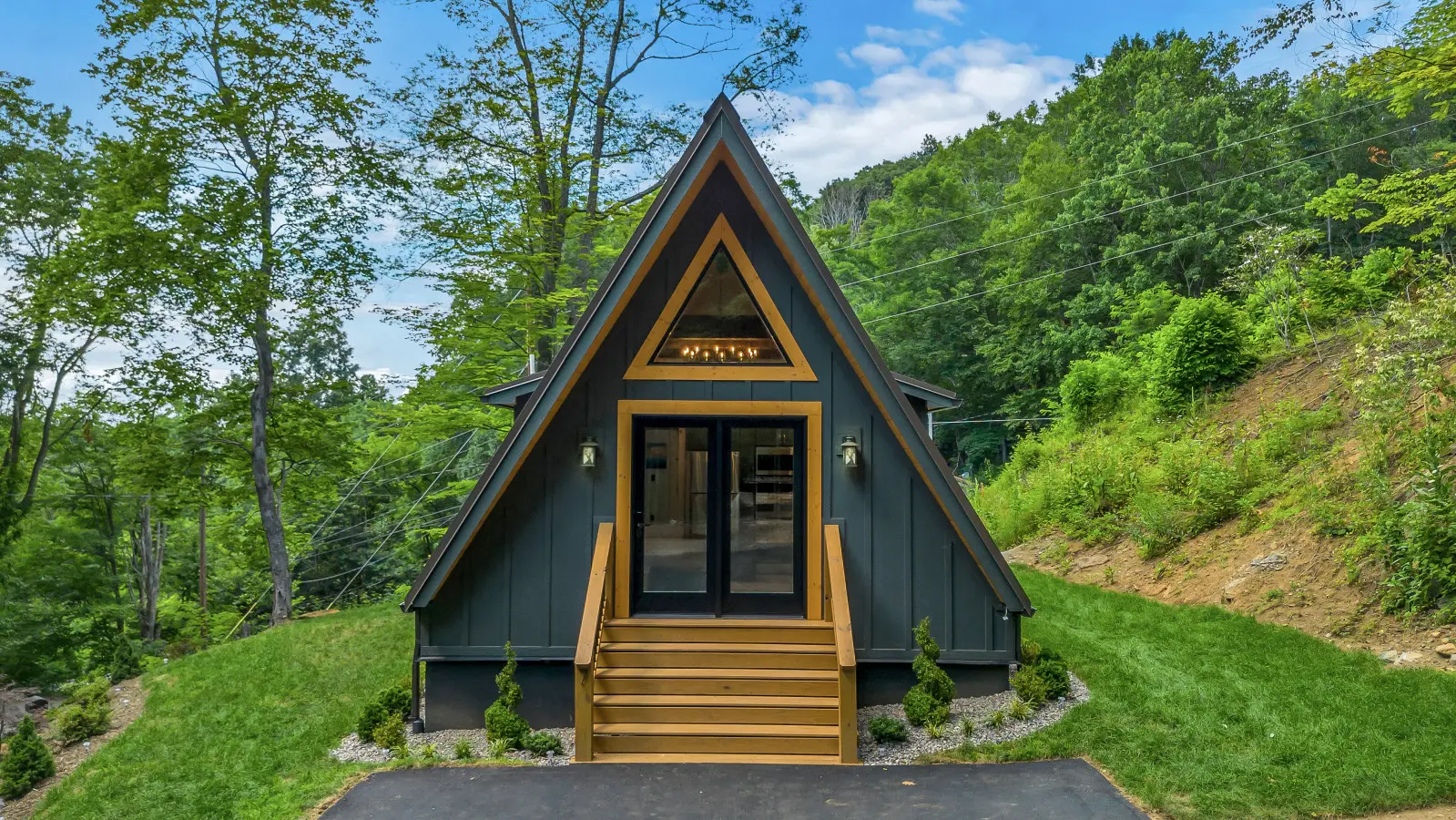 A-frame cabin exterior with a triangular wood front